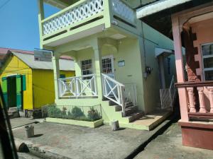 Yellow, green and pink houses