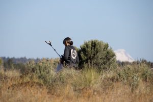 Marion grabbing garbage at Herbers Canyon
