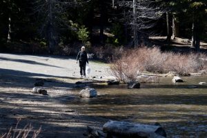 Marion grabs garbage at Frog Lake